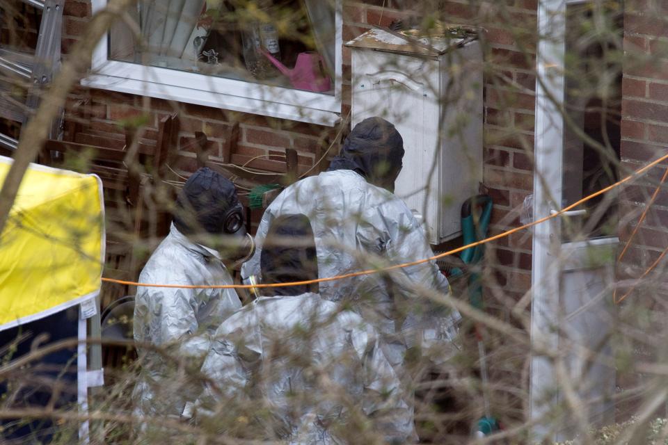  Forensics officers trawling through the Skripals' home. The father and daughter are now close to recovering