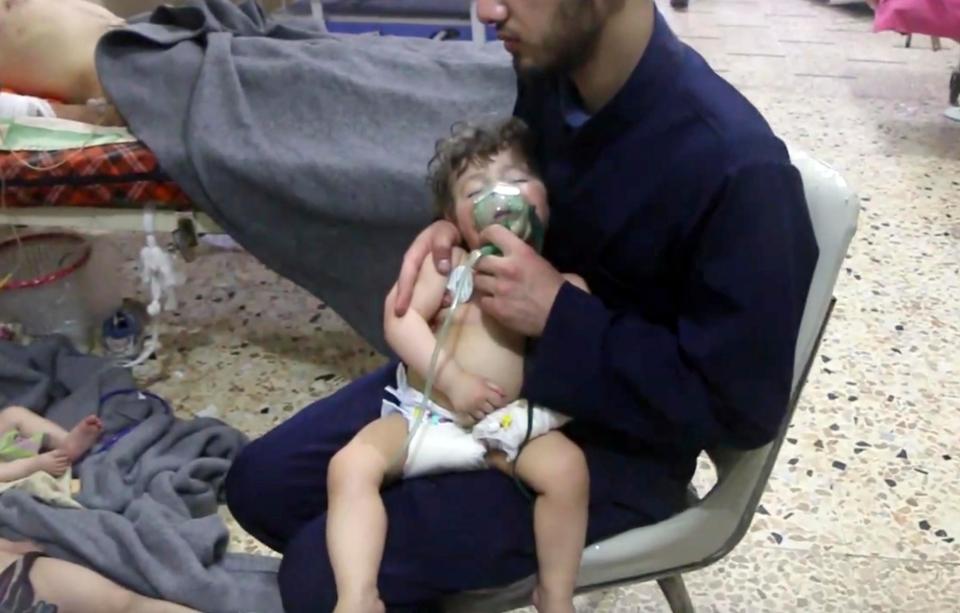  This toddler was one of the lucky ones and an aid worker is giving them oxygen