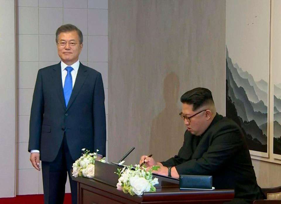 Kim stopped to sign a guest book in the South's Peace House
