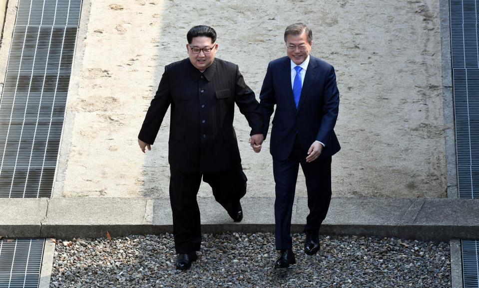 The pair signified a huge step towards peace between the warring countries as they smiled while crossing the border