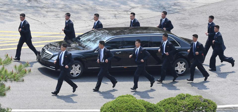 The footage shows the guards surrounding the car after their leader got in