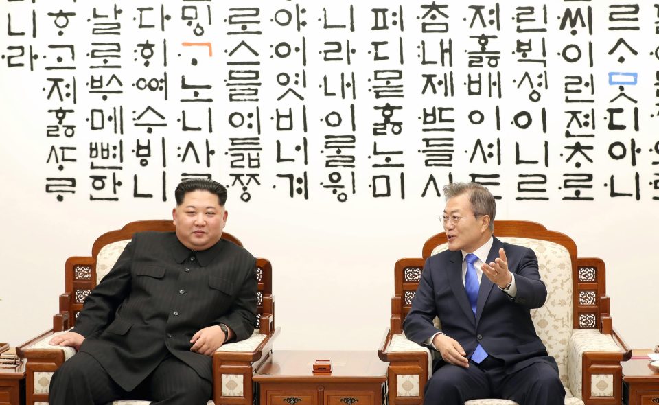 The pair were pictured inside the blue Peace House in the border village