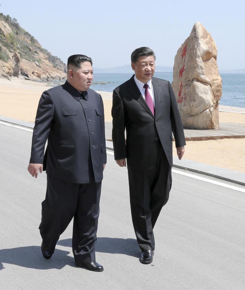Chinese President Xi Jinping and North Korean leader Kim Jong Un in Dalian, Liaoning province yesterday