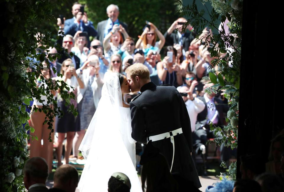 Crowds cheered as Meghan and Harry kissed - the loved up couple having tied the knot after a whirlwind romance