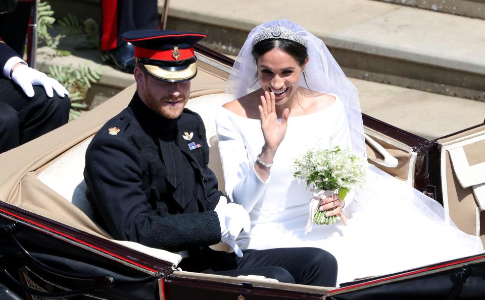 Prince Harry and Meghan Markle were met with screaming fans as they were greeted by happy crowds