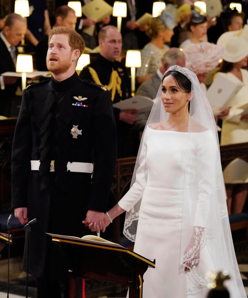  Prince Harry looks up as her marries his bride Meghan in a modern ceremony overseen by an American bishop