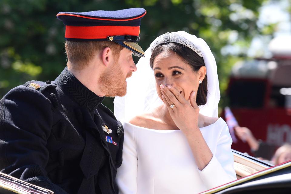 Meghan Markle couldn't contain herself as she beamed at Prince Harry