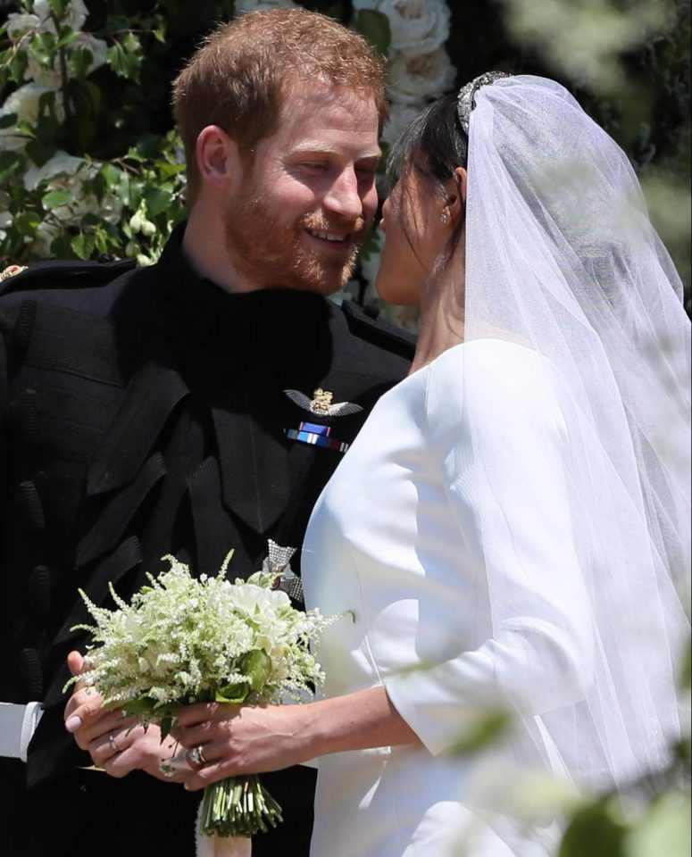 Prince Harry smiled as he got to finally give his wife a kiss, after telling her that he 'missed her' after spending the night apart