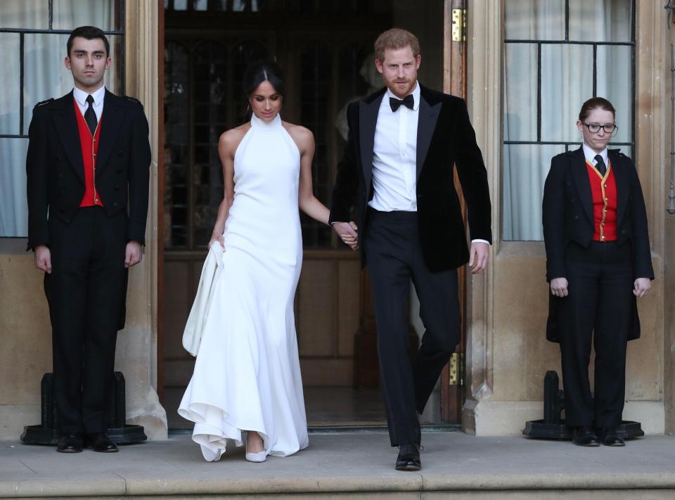  Harry looked dapper in a tuxedo, while Meghan was modern with her shoulders out in the full length Stella McCartney gown