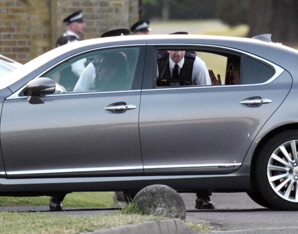  The couple's car was pictured being stopped at the gates