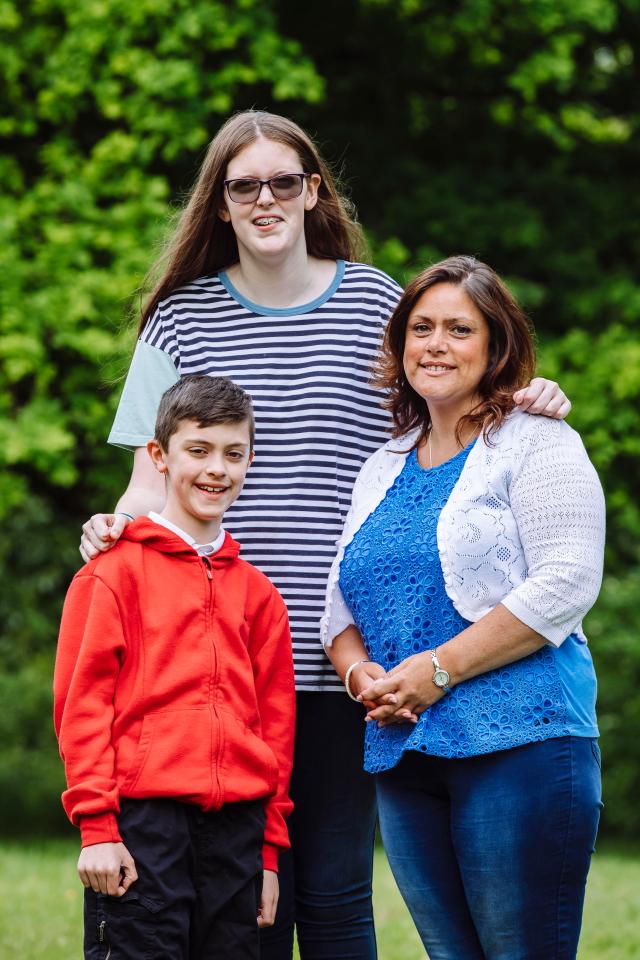  Sophie, 12, towers over her brother, mum and dad