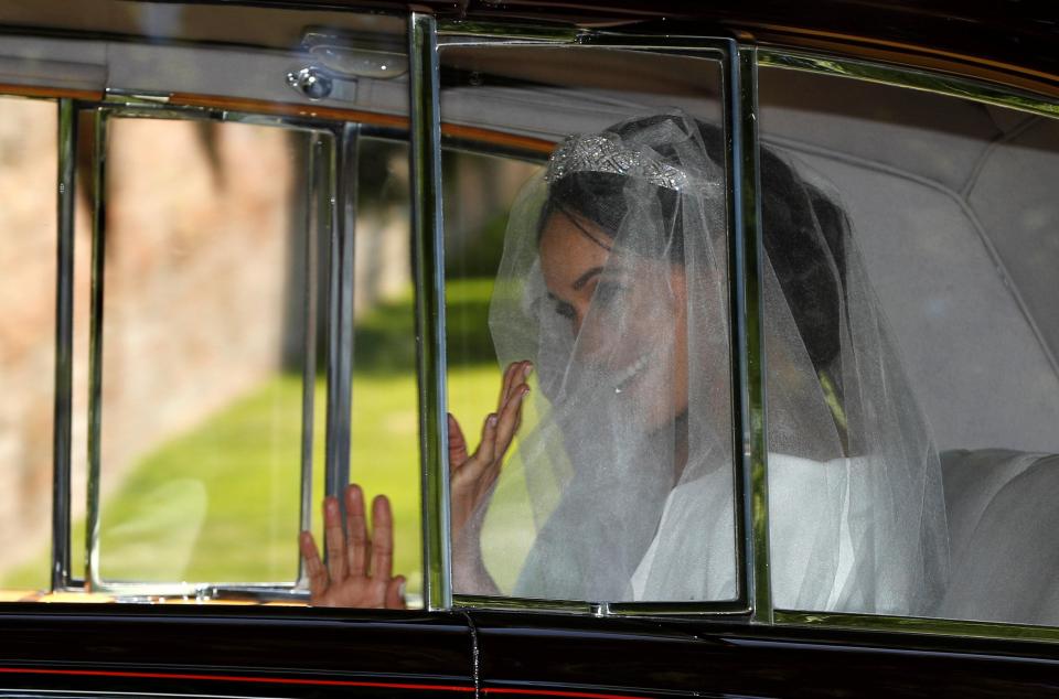 Meghan Markle waved as she made her way to the chapel to marry Harry