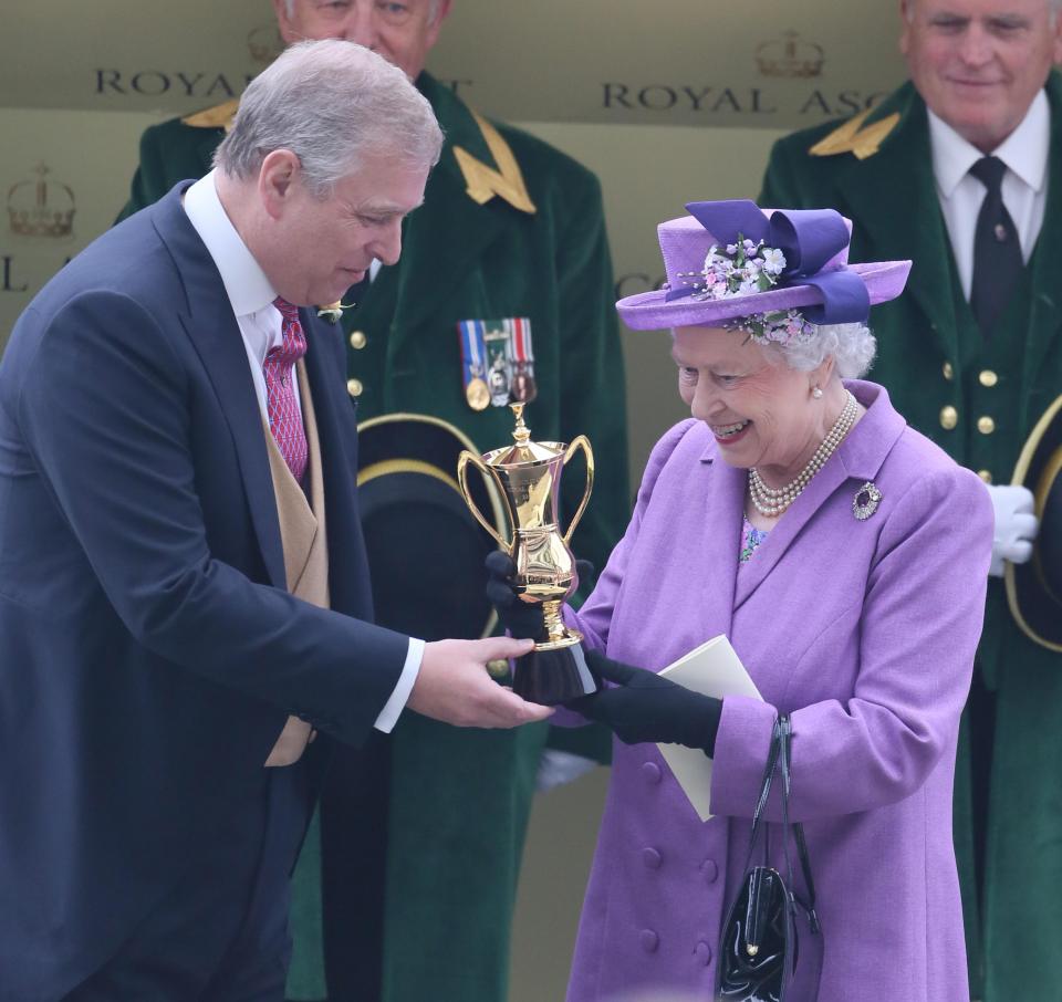  The Queen receives her trophy