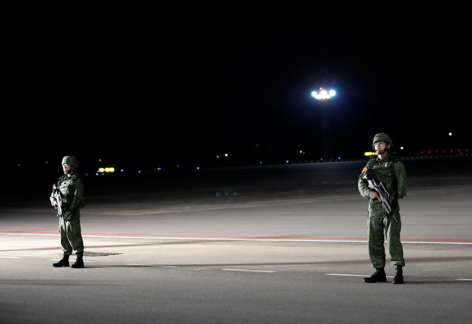  Soldiers stand guard at Peya Lebar Air Base in Singapore, as Trump arrives