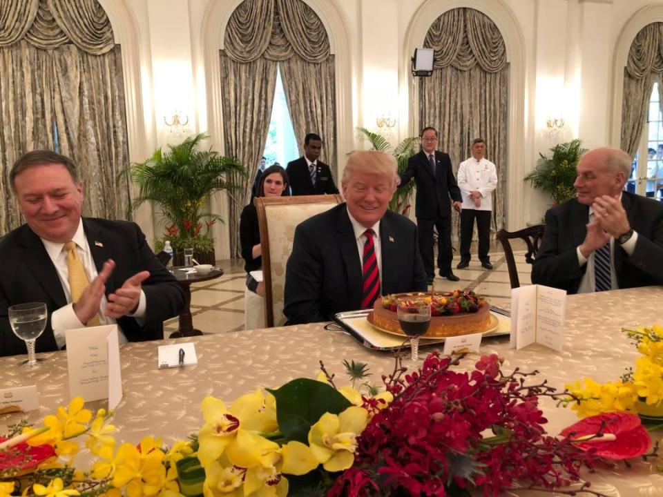 Donald Trump, who turns 72 on Thursday. was presented with a birthday cake as he sat down to a working lunch with Singapore's Premier