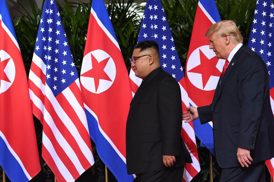  The president then put his hand on Kim's back and ushered him away from the photo op