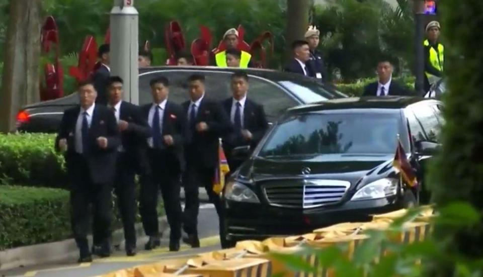 They're back... Kim's men in black are put through their paces protected the tyrant