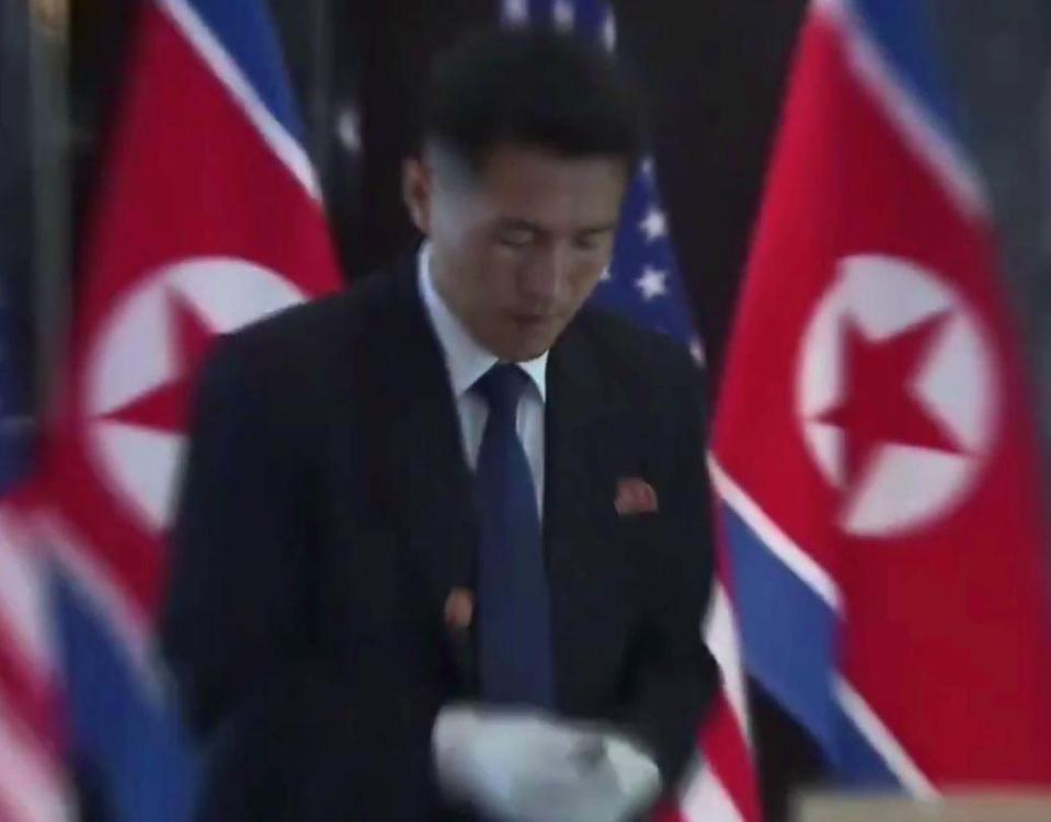 Seconds before one of Kim's bodyguards was seen examining the pen