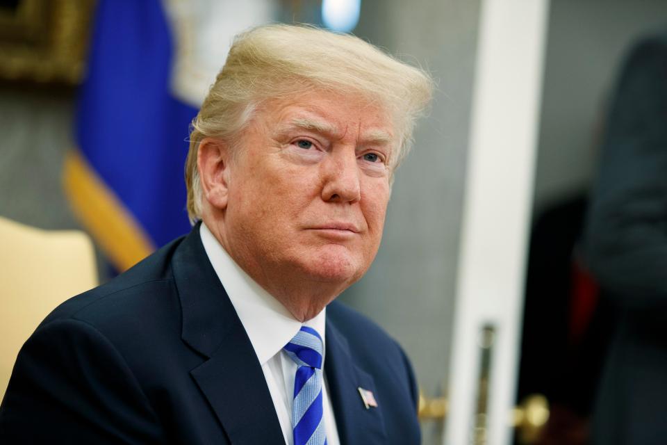 Demonstrators claim the 'mutant clone' of the President will show that 'fascists are not welcome in the UK'