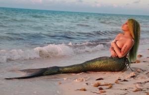 Nicki Minaj poses topless dressed as a mermaid in images from he
