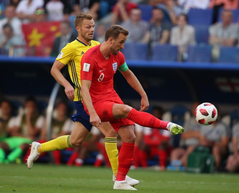 Harry Kane clips a pass away under the watchful eye of Seb Larsson