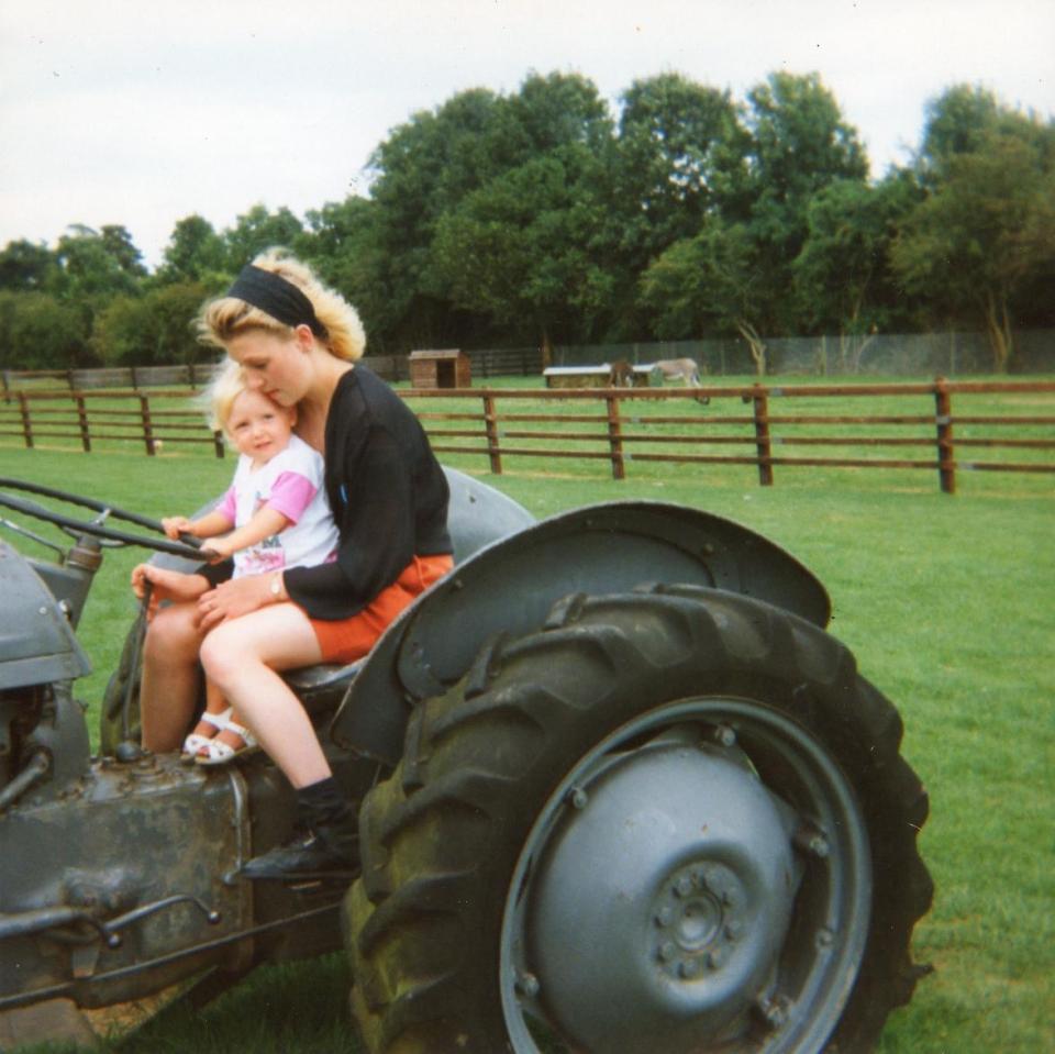  Dawn holding her baby sister on a family trip to a farm