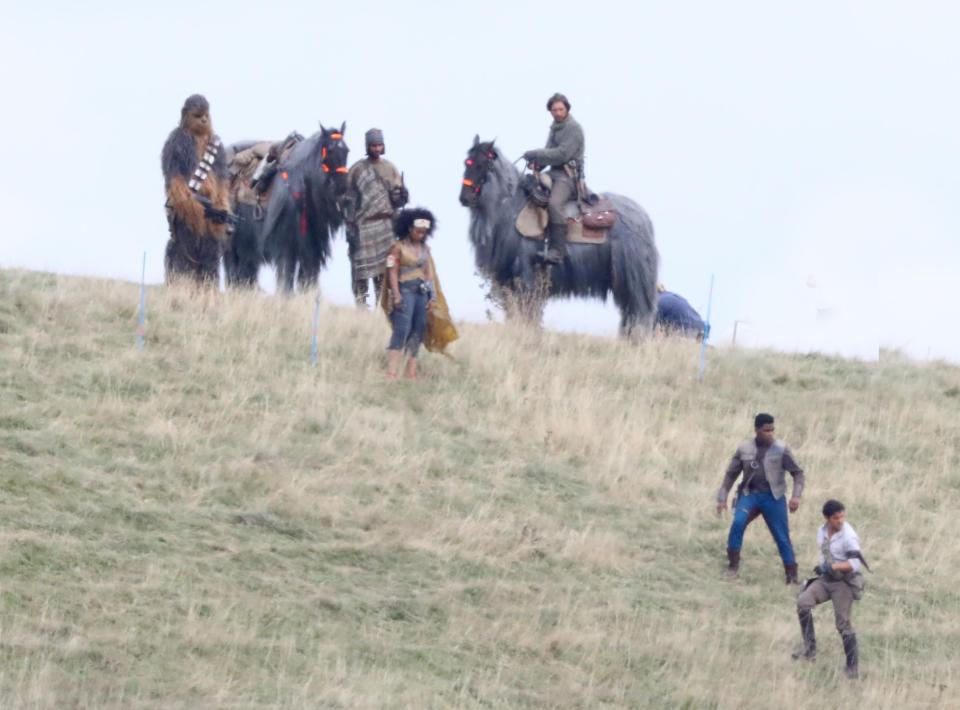  John and Oscar, who plays Poe Dameron, leapt into action and were spotted running across the path of Chewbacca and his friends