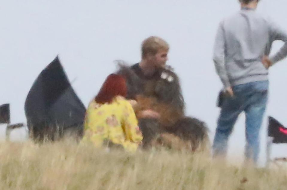  He looked exhausted as he took the top of his outfit off and had a rest