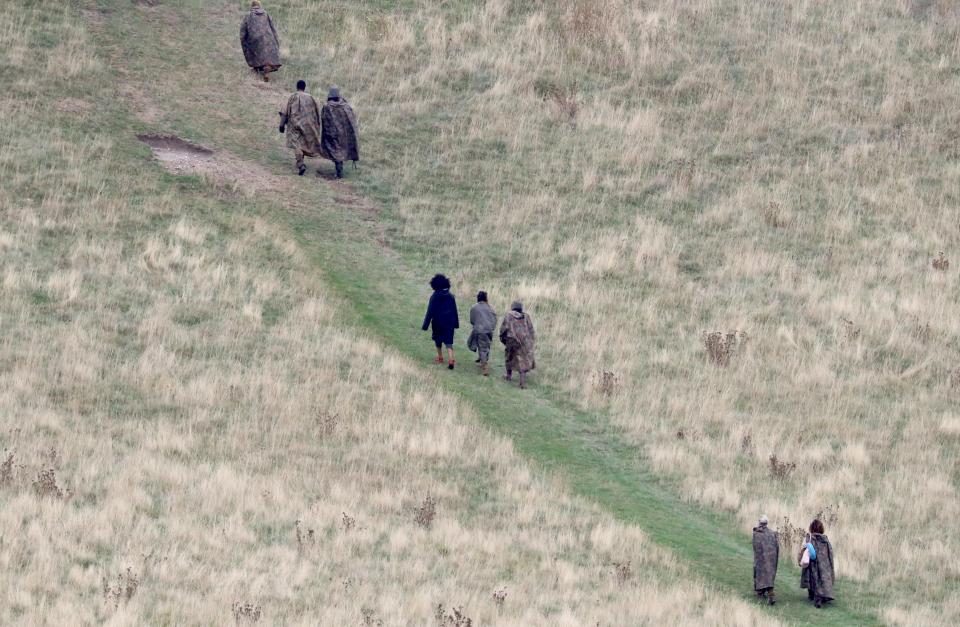  Once the shoot resumed, the extras could be seen trudging up the hill to meet Chewbacca, Finn and Poe at the top