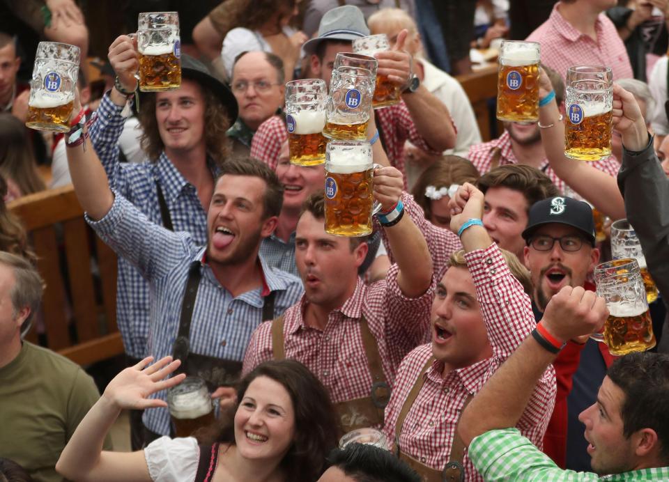Visitors celebrate in a beer tent on the opening day of the 2018 Oktoberfest beer