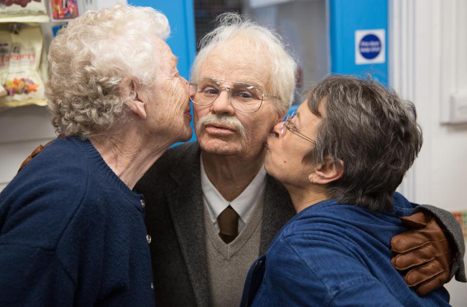  The charity shop workers share a hug and a kiss with Rhian who managed to surprise them