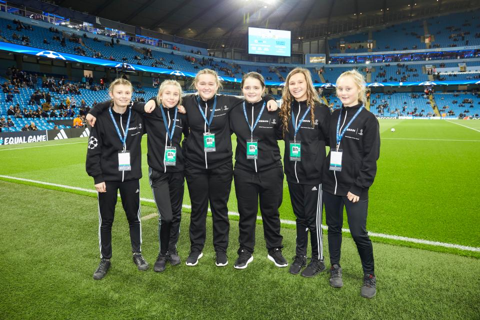 Six children will be given the chance to wave the UCL flag with their own tracksuit to keep