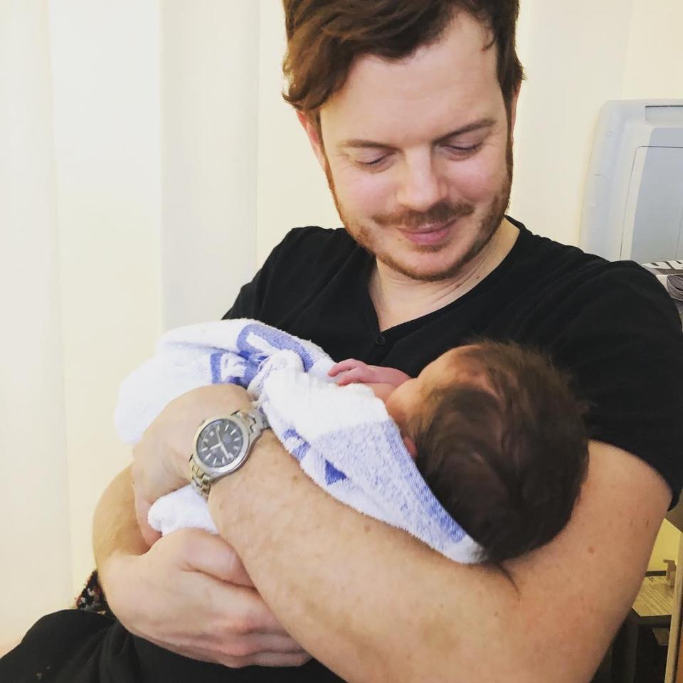  Proud dad Richard Jones cuddles newborn Mickey in the picture posted yesterday