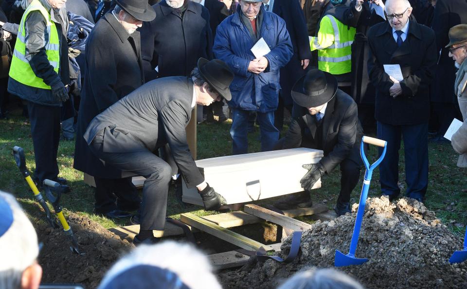  A small coffin that held the remains of all six victims was buried with earth from Israel