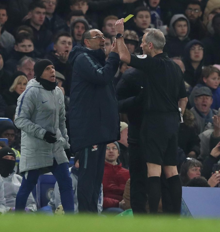 Chelsea manager Maurizio Sarri is shown a yellow card for his protests during Spurs game