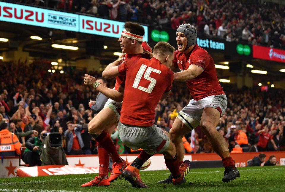 The Welsh boys celebrate after Josh Adams collects a bobbling high ball to score the try that wins it for the Welsh