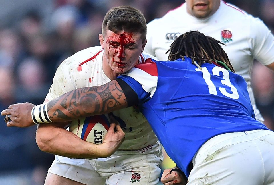 England's flanker Tom Curry is tackled by France centre Mathieu Bastareaud