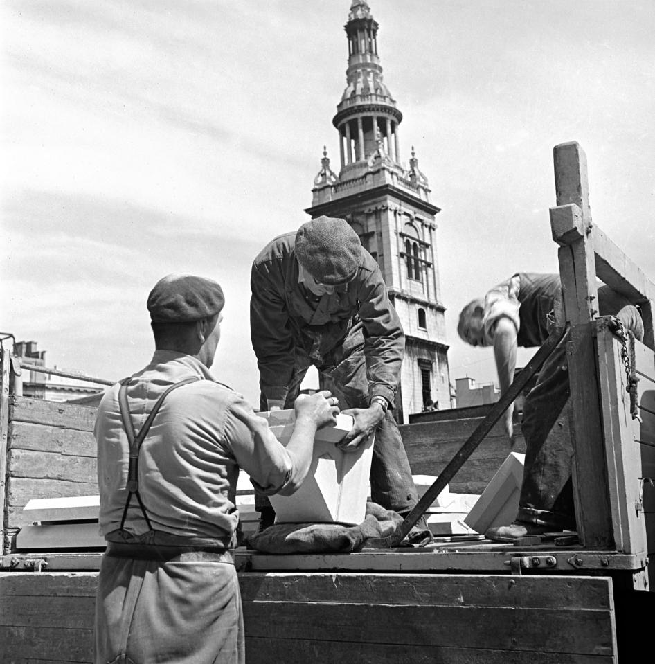  A group of dedicated workmen were seen moving salvaged rubble on to the back of a lorry so the restoration project could continue