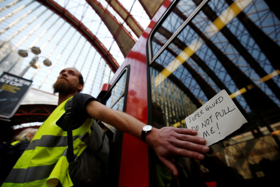 Former Buddhist teacher Mark Ovland, 35, is part of the Canary Wharf action