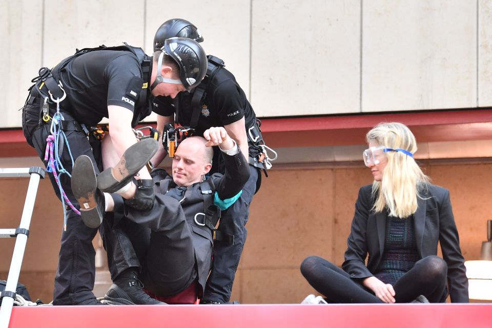  The pair were pulled from the top of the DLR train after gluing their hands to the roof