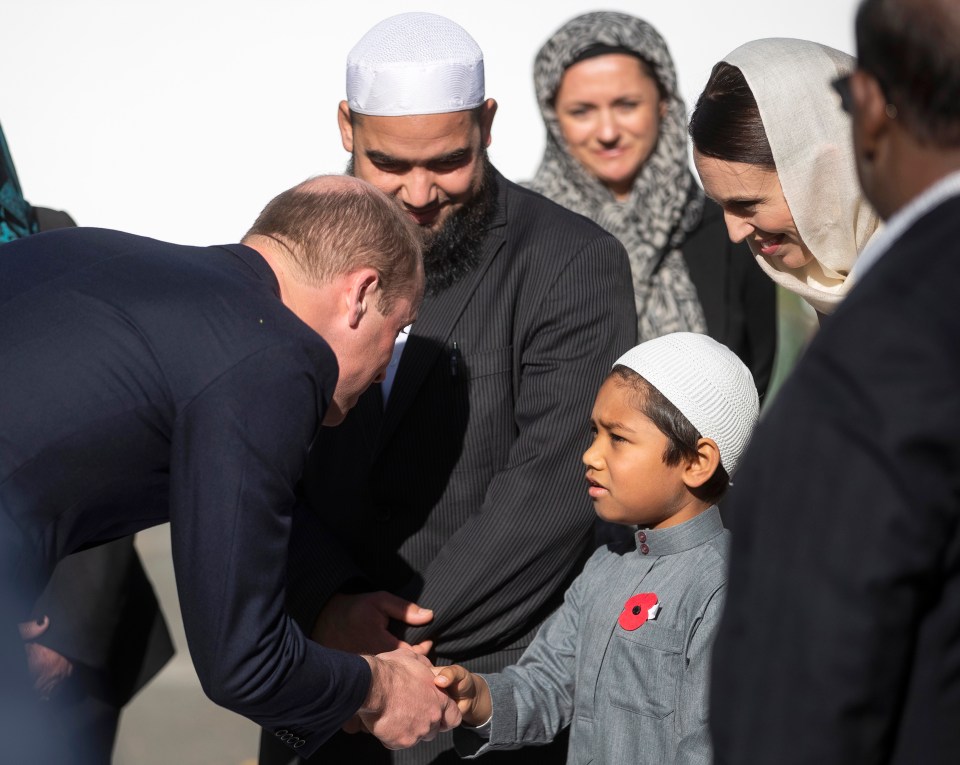  Prince William shakes hands with a young boy at a mosque in Christchurch, New Zealand