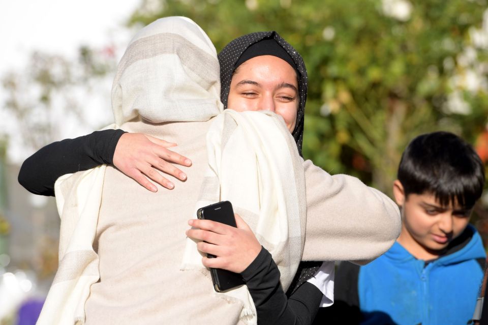  New Zealand's Prime Minister Jacinda Adern also embraced people in the crowd
