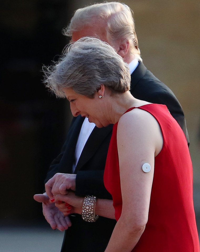 Theresa May seen with a diabetes patch on her arm during a dinner with Donald Trump in 2018