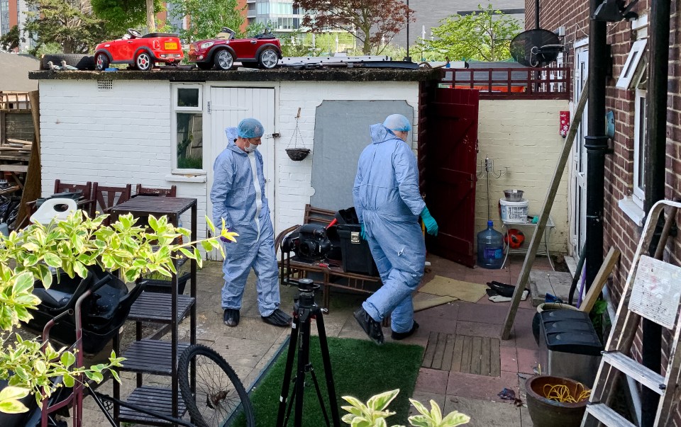  Forensics in the back garden of the address in Canning Town where the two bodies were discovered