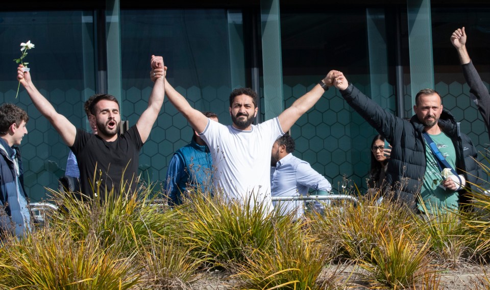  Mosque shooting survivors from left, Mustafa Boztas, Wassail Daragmih and Temel Atacocugu celebrate as they leave the Christchurch High Court after the sentencing hearing for Australian Brenton Tarrant