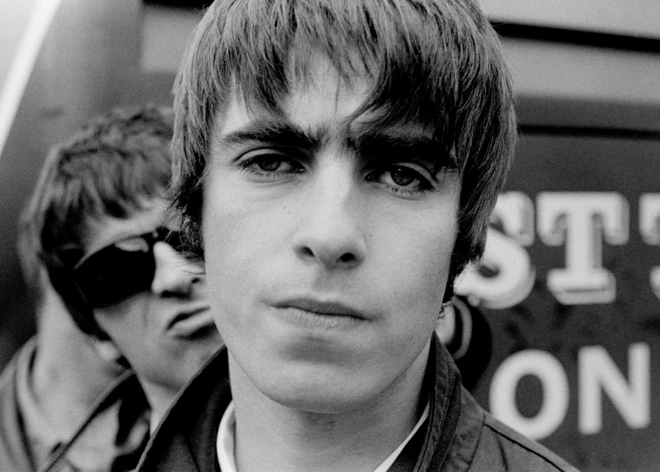 Liam Gallagher with brother Noel (behind him) formed Oasis, Britain's biggest rock band in the Nineties