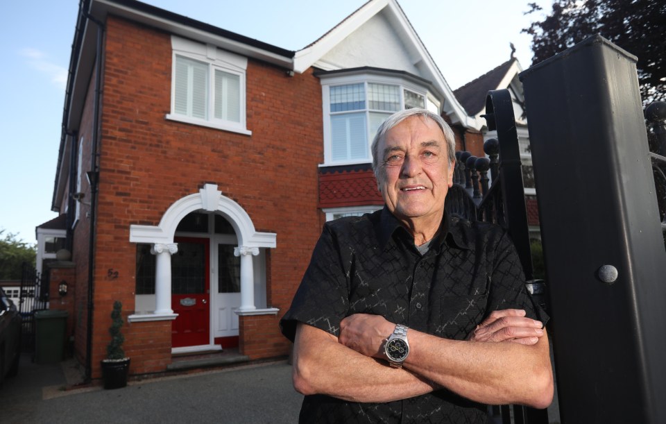  The lotto winner, today, poses at his £300,000 semi in Grimsby