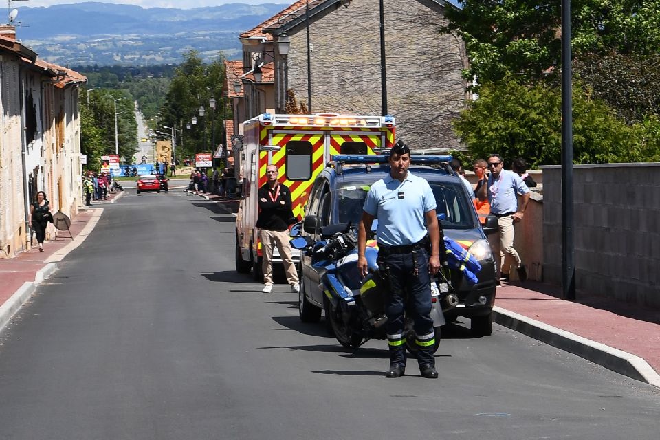  Froome was recovered by an ambulance from this street in Roanne, France - Brailsford added that it would be 'quite a long time' before he races again