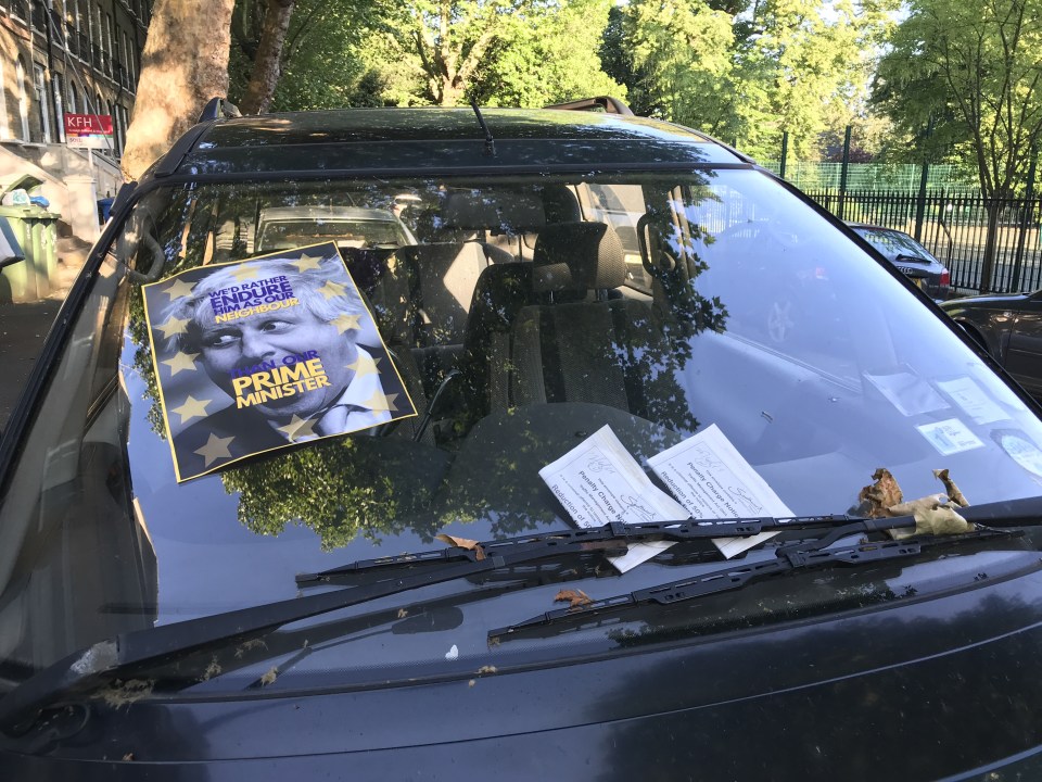 Boris Johnson's car with two parking tickets and a 'hate' poster