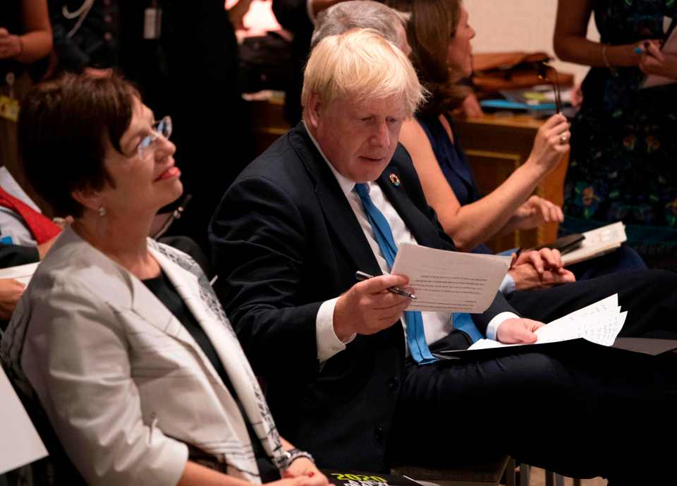 Boris Johnson works at a speech in the UN as his Parliament prepares to reconvene without him